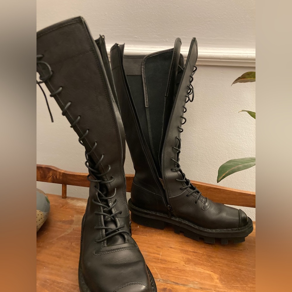 Trippen just below the knee combat boots.